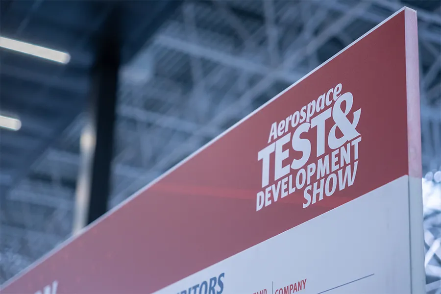Theta Technologies company representatives showcasing non-destructive testing products for aerospace at a recent exhibition