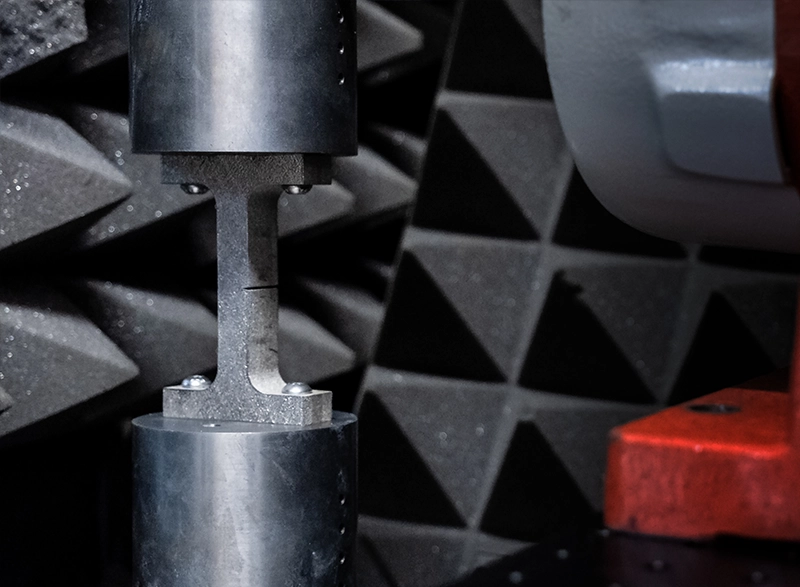 An additive manufactured metal part being prepared for a nonlinear resonance NDT test
